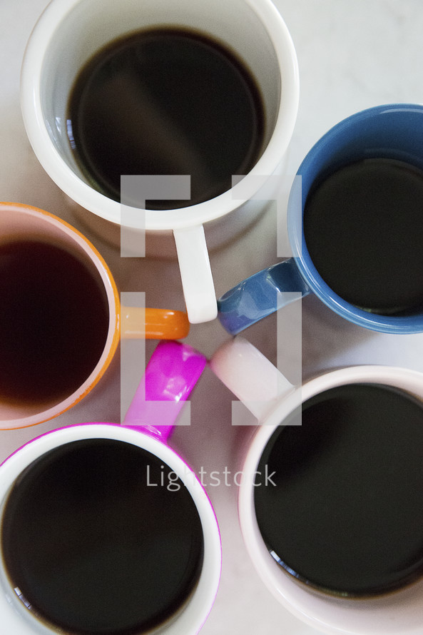 colorful coffee mugs in a circle 