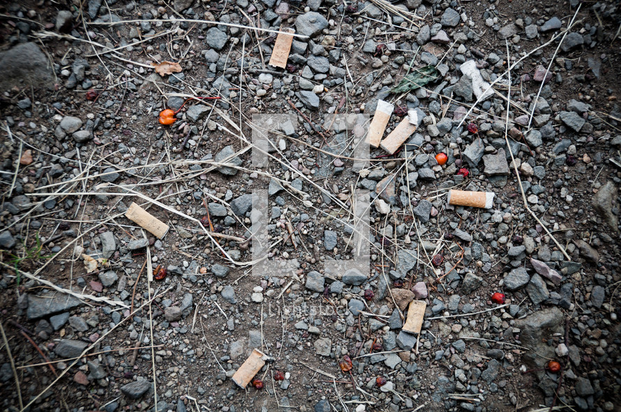 cigarette butts on the ground 
