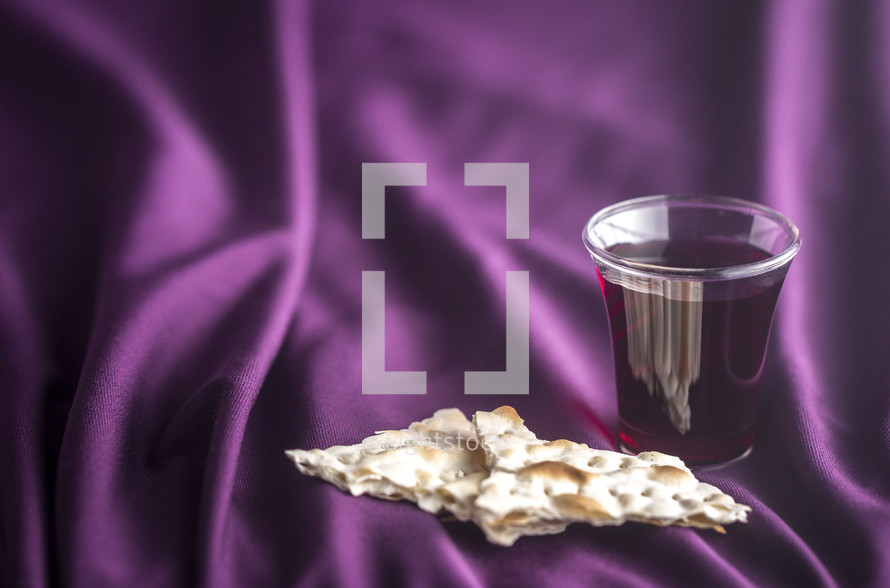 communion elements on purple fabric 