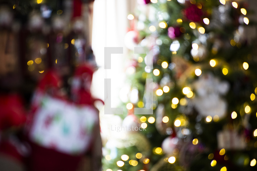 Christmas tree and stockings as a blurry background