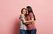teen girls hugging 