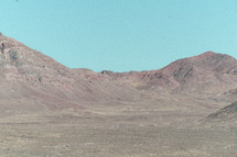 a desert valley surrounded by mountains 