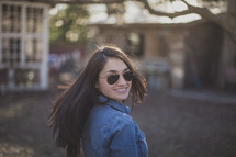 A pretty young woman wearing sunglasses