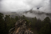 fog and clouds over a mountain top 