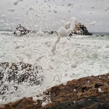 Ocean waves splashing on rocks