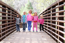 kids on a footbridge 