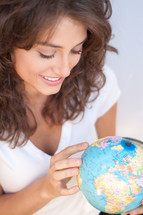 woman holding a globe