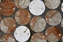 rusty circular metal pieces 