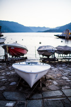 boats on the shore of lake Como 