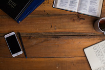 A Bible study border, Bible, cellphone, books, pen, coffee mug, journal 