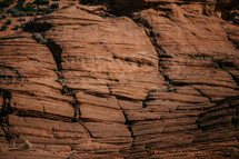 surface of a red rock canyon cliff 