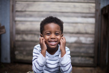 portrait of a smiling African American toddler boy 