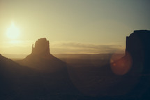 silhouette of a rock peak at sunset in the desert 