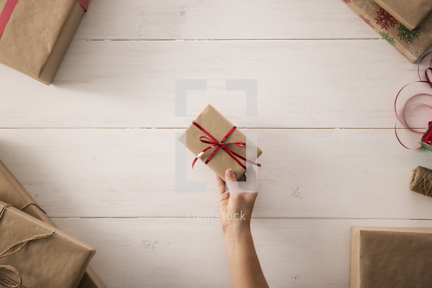 a woman holding a wrapping gift 