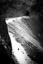 foot trail through a tunnel in a mountain