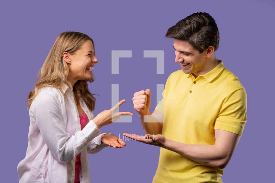 Positive funny couple playing rock paper scissors. Settling dispute method, decision. Rochambeau team games. High quality