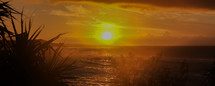 sunburst over the ocean at sunset 