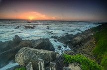 rocky beach shore at sunset 