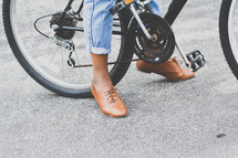 feet supporting a bicycle 