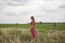 woman standing in a field 