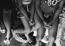 children with praying hands 