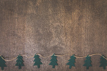 paper Christmas trees on wood 
