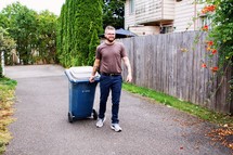 a man taking out the trash 