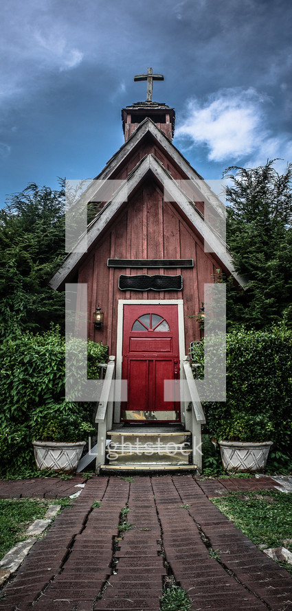 Country church house with a red door.