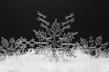 Snowflake ornaments in snow 