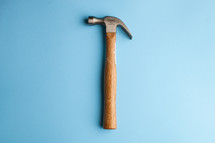 Hammer centered on a blue background.