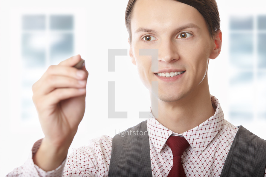 businessman holding a stylus 