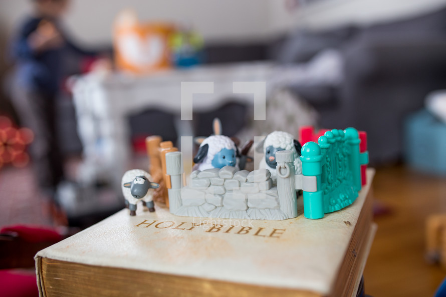 toy manger Biblical figures on a Bible 