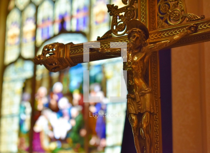 gold crucifix in a cathedral 