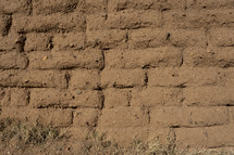 A clay brick wall on an ancient building