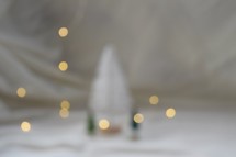 bokeh lights and Christmas trees on a white background 