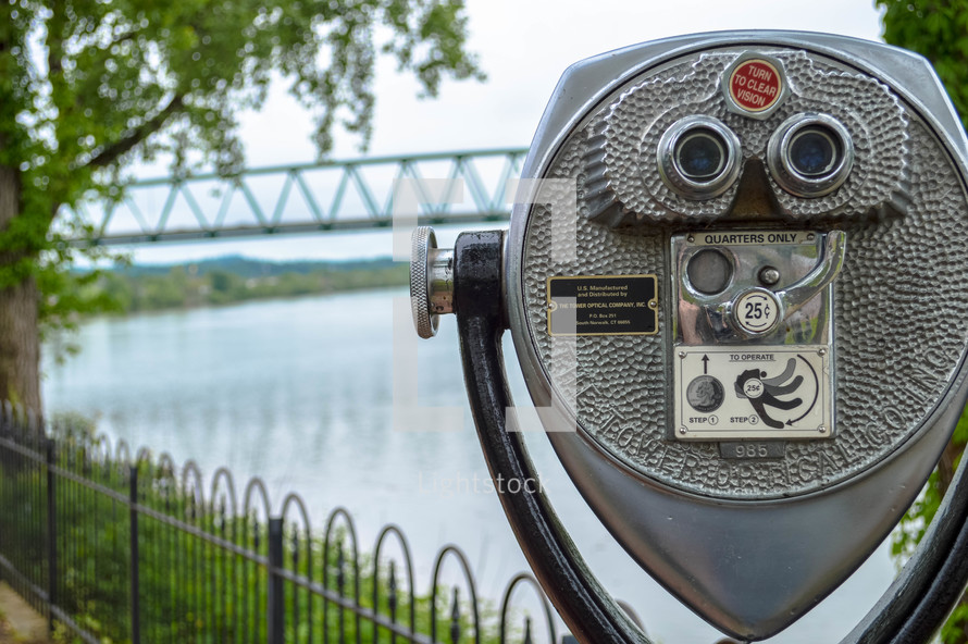viewfinder scope at a park overlooking water 
