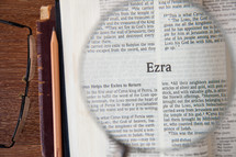 magnifying glass over Ezra