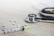 stethoscope, needle, and drugs 