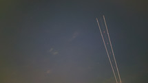 Multiple flying Airplane light trails blinking in the dark sky long exposure photography