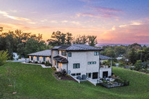 Luxury Home on a hill at sunset