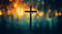 Rainy day with a cross in the background and bokeh lights. 