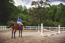 teen girl riding a horse 