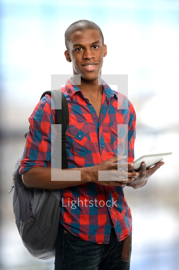 college student holding an iPad 