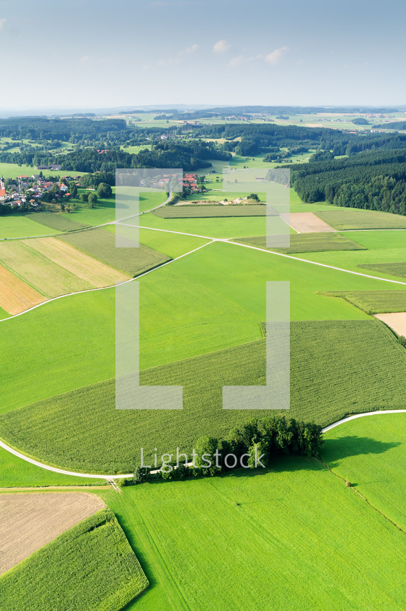 aerial view over green farmland in Bavaria 