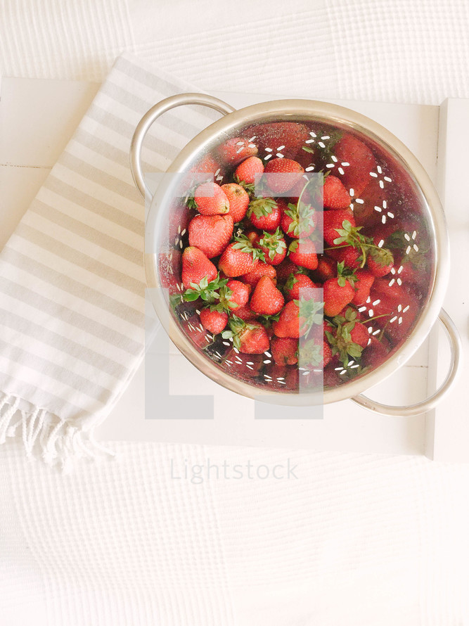 a bowl of strawberries 