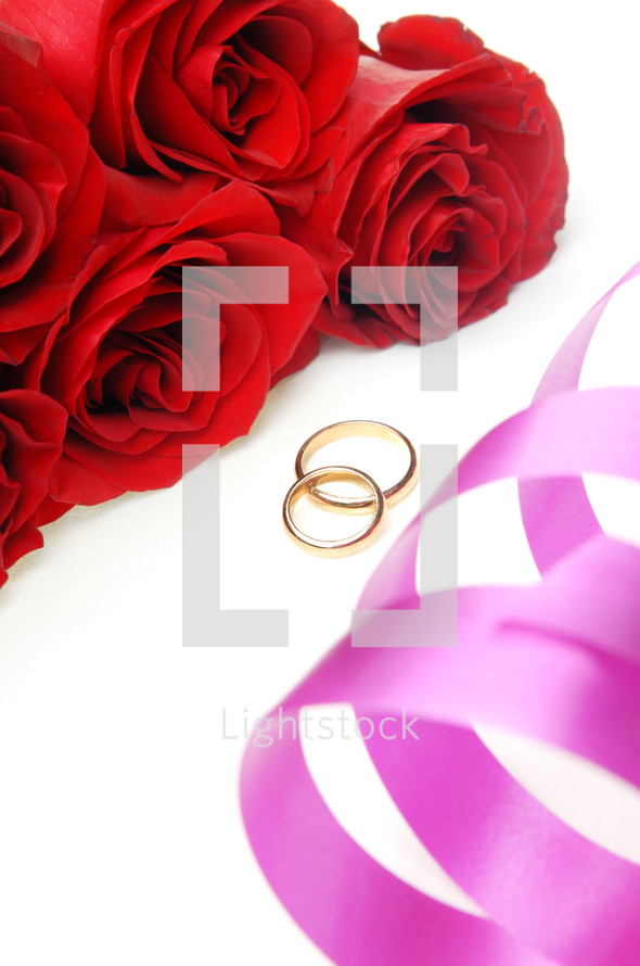 red roses and wedding bands 