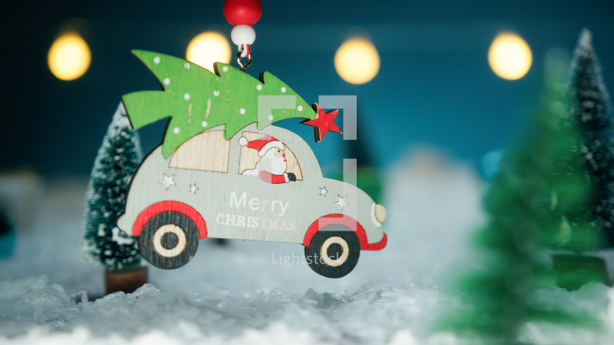 Santa Claus and his car over the snow