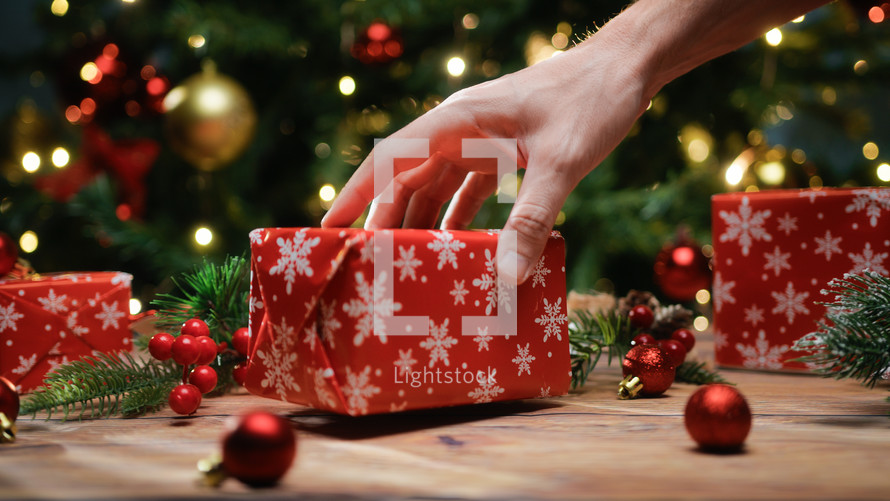 Christmas gifts with decorative paper under the tree