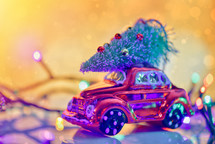 Christmas tree on toy car. Christmas holiday celebration concept