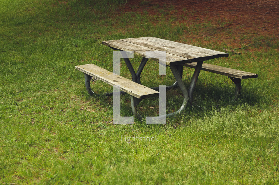 picnic table in grass